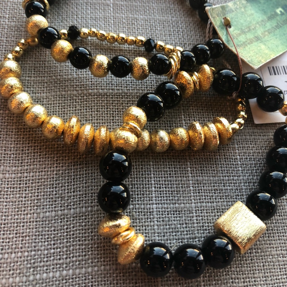 Onyx and gold bracelets